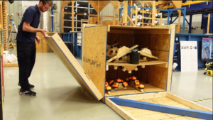 NIST dexterity cube deployed during standardized robot manipulation evaluation.